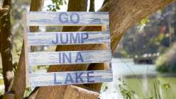 Make a summertime sign using a wooden palette perfect for lake house or cabin decor.