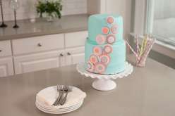 Emily Tatak of Wilton teaches how to use fondant to create a smooth finish on a stunning tiered cake in this baking and cake decorating class.  Come decorate cakes with color fondant to cover a two-tiered stacked cake.