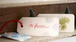 Stamped and Embossed Christmas Gift Tags: Courtney Cerruti shows how to create custom paper gift tags using rubber stamps, ink and embossing powder – perfect for topping off your holiday gift wrapping.